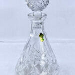 front of Waterford Lismore Roly-Poly Decanter